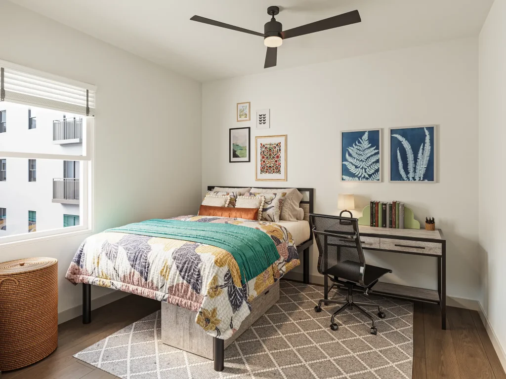 Fully-furnished student bedroom featuring a queen-sized bed and private bathroom near NC State.