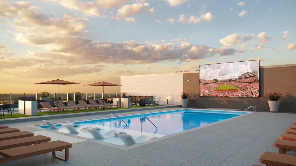 signature at varsity apartments rooftop pool with jumbotron