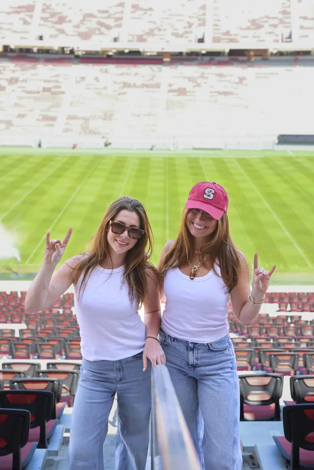 signature at varsity off campus apartments near nc state lifestyle shoot go pack hand signal carter finley football stadium